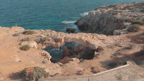 stone arch at the coast - aerial view