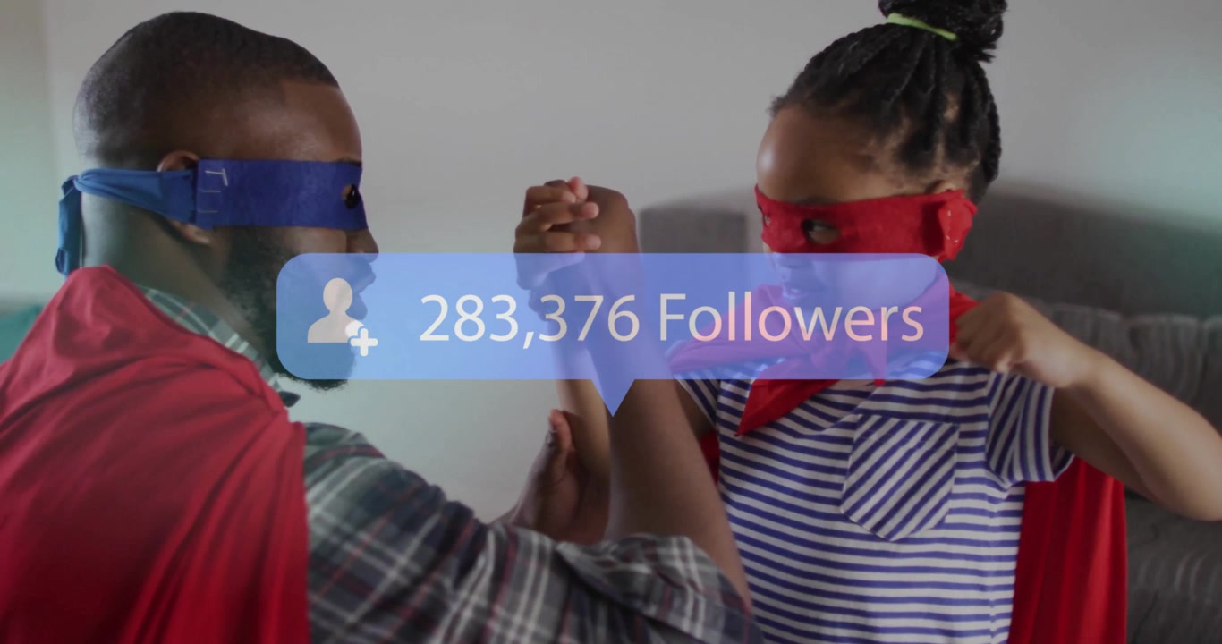 Father and daughter in masks and capes locking hands, arm wrestling updating digital follower count