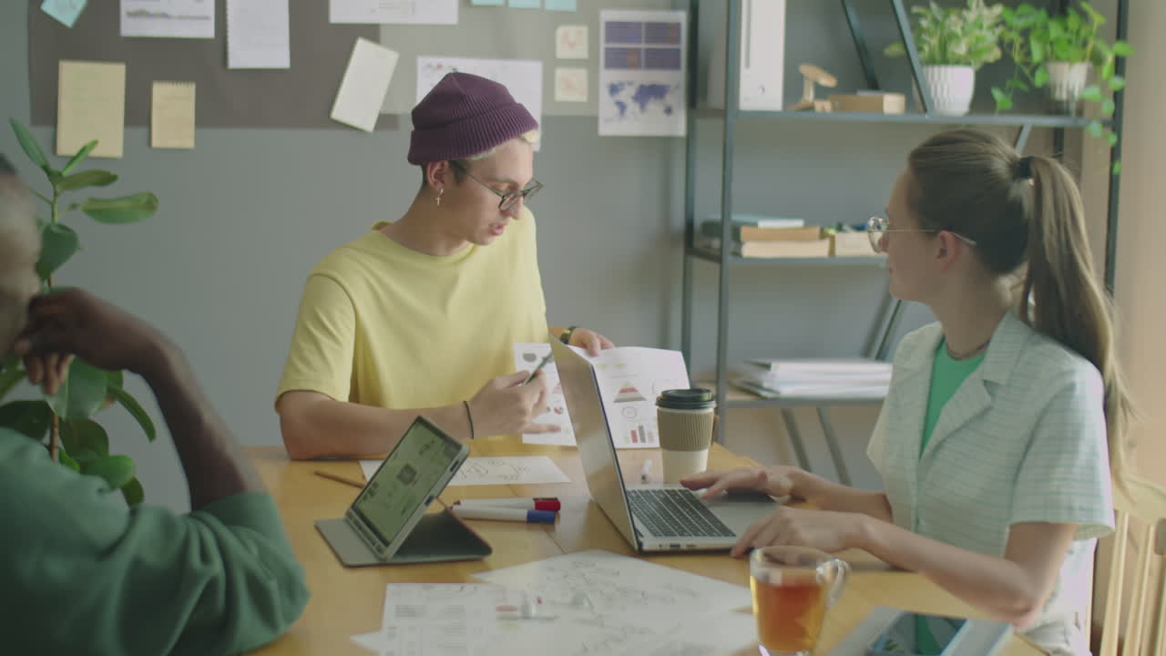 Gen Z Multi-Ethnic Team Having Discussion during Office Meeting