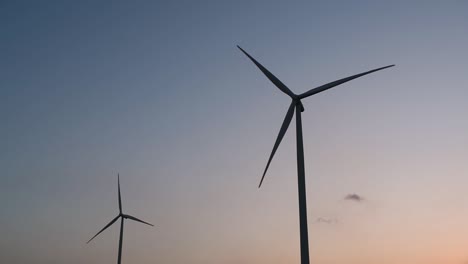 Wind-Turbines-Silhouette-against-the-Blue-sky-during-Sunset,-clean-alternative-energy-in-Thailand-and-mainland-Southeast-Asia