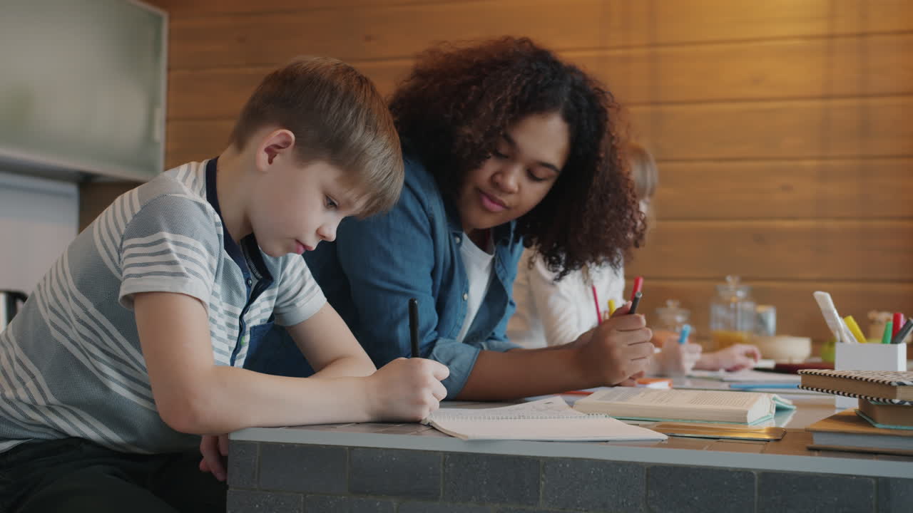 Kids doing homework with a tutor