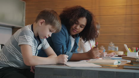 kids doing homework with a tutor