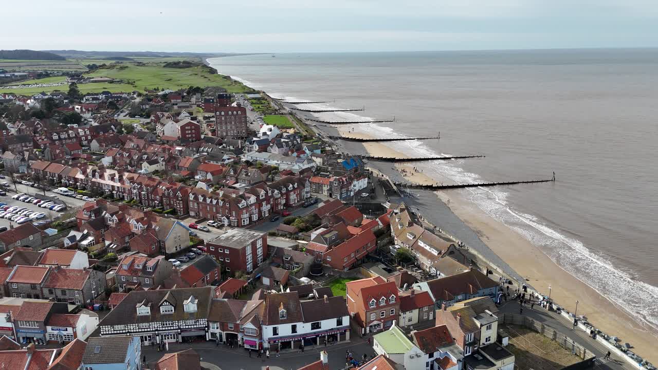 Sheringham beach and town Norfolk UK seaside town reverse aerial view