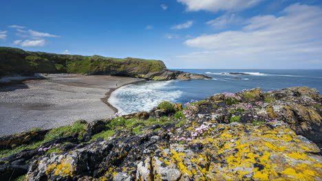 panorama motion timelapse of rugged coastline with moving clouds and grass sea rocks in aughris head in county sligo on the wild atlantic way in ireland