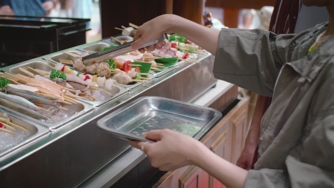 Couple Having Skewers for Lunch Going Shopping on Street Food Market