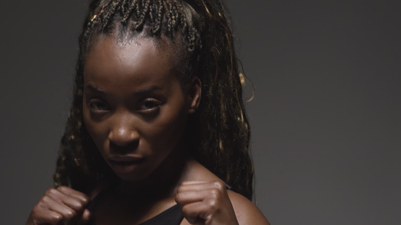 Studio Portrait Of Young Woman Wearing Fitness Clothing Training For Boxing In Gym 1