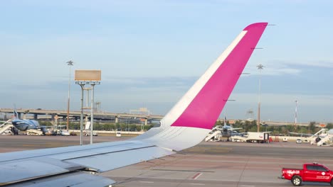 airplane wing and tail at airport