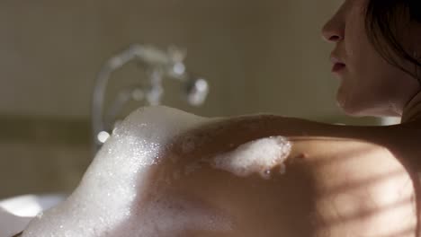 woman enjoying a relaxing bath