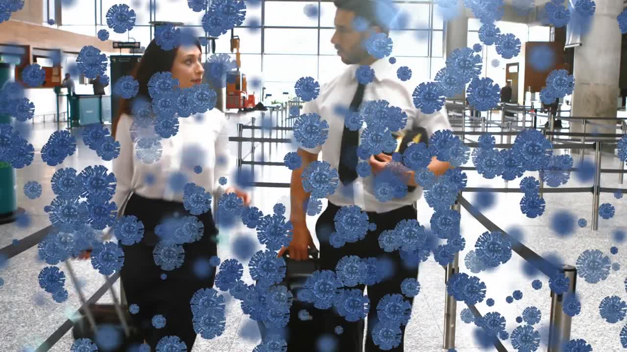 두 명의 백인 노동자 위에 떠다니는 거대 코로나19 세포의 애니메이션