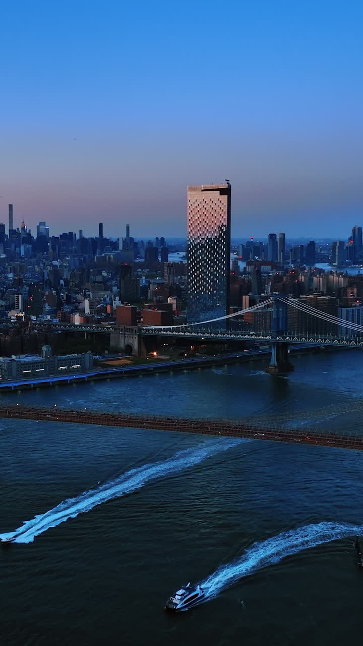 Downtown building nightlife. Illuminated New York streets aerial shot. Vertical video