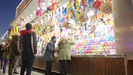 carnival game booth with people