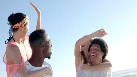 diverse friends enjoy a sunny beach day