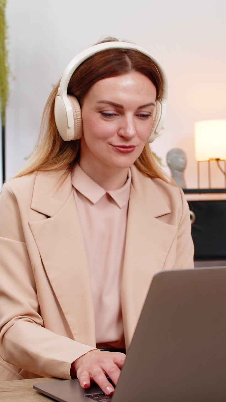 Businesswoman types report with earphones calm music focus rhythm nod focused look productive flow