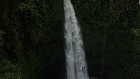 the power of nungnung waterfall on a sunny afternoon in bali, indonesia