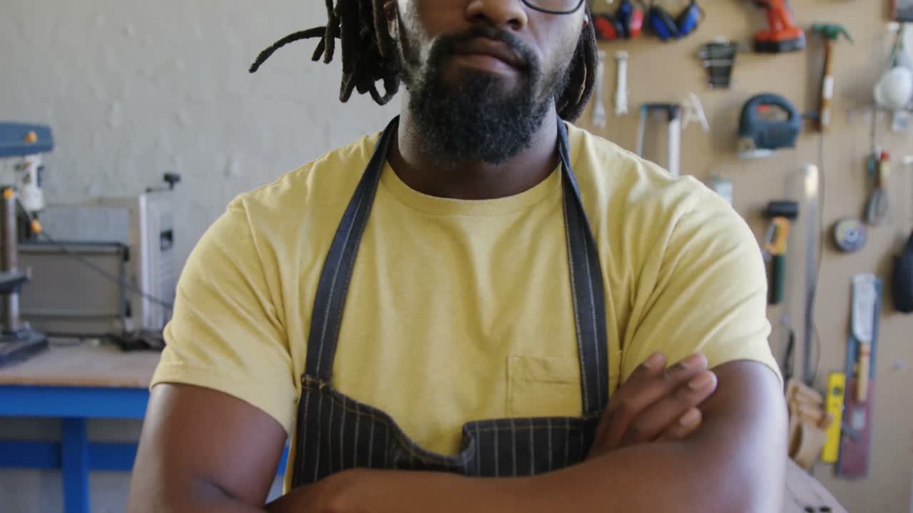 Portrait of confident carpenter standing with arms crossed 4k