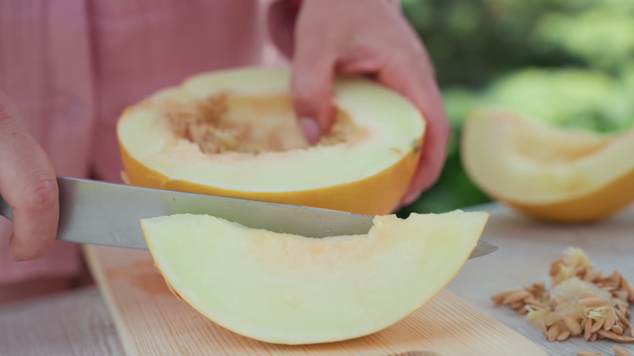 Outside Setup With Careful Melon Cutting, Food Blogger Arranging Fresh Melon Wedges Carefully Outside, Photograph Capturing Detailed Melon Slices For Summer Recipe Content Outdoors