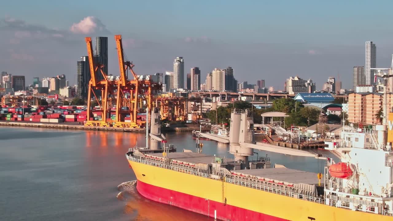 View of Bangkok city and port with ships in the water in the evening