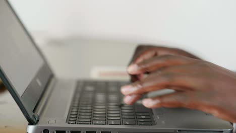 african lady working on laptop - close up shot