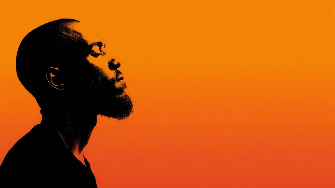 A Contemplative Portrait of a Man Against a Warm Gradient Background, Emphasizing Profile, Expression, and Mood in an Artistic Setting