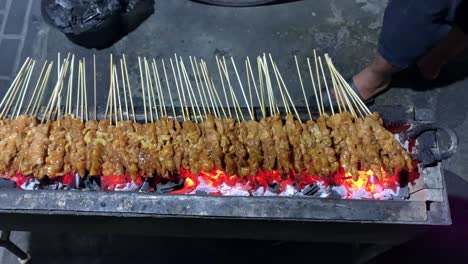 chicken satay on traditional charcoal fire