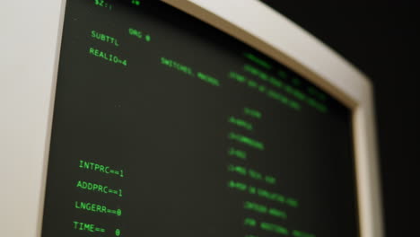 Vintage Computer Monitor Displaying Code