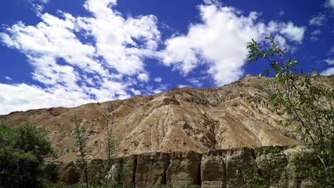 Bright-sunny-day-as-showing-around-with-the-camera,-point-of-view-shot-as-looking-around-in-the-mountains