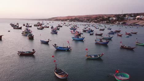 Calm-Sunset-Over-Colorful-Fisherman-Boats-At-The-Bay-Of-Mui-Ne,-Vietnam