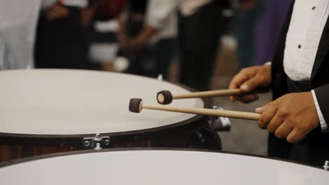 man playing drums during semana santa processions in historic city of antigua, guatemala