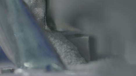 production of medicinal material that forms tablets in a high-precision machine, ensuring accuracy and quality.