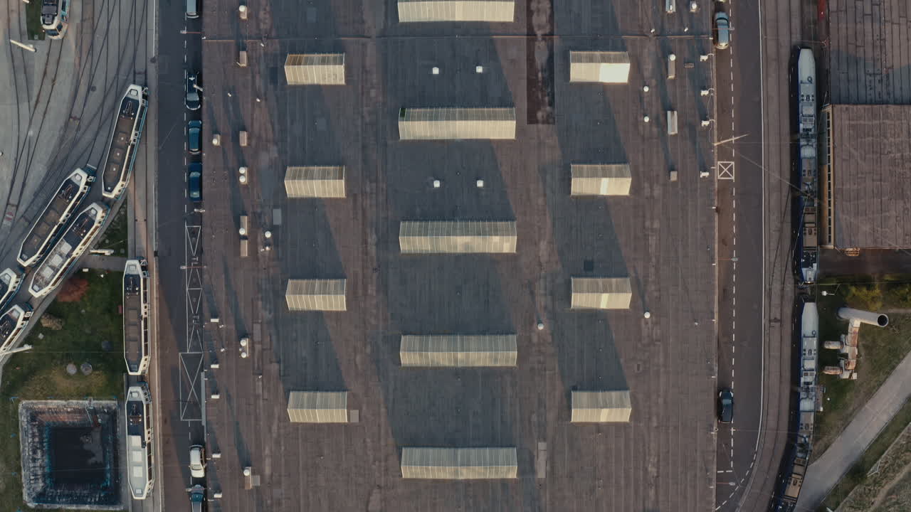 Aerial View of a Rooftop Parking Garage with Tram Station