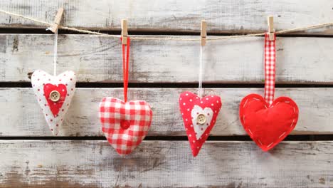 heart shaped decorations pinned on a rope 4k