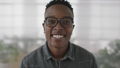 portrait of young african american business student intern man smiling cheerful at camera enjoying corporate lifestyle black guy wearing glasses