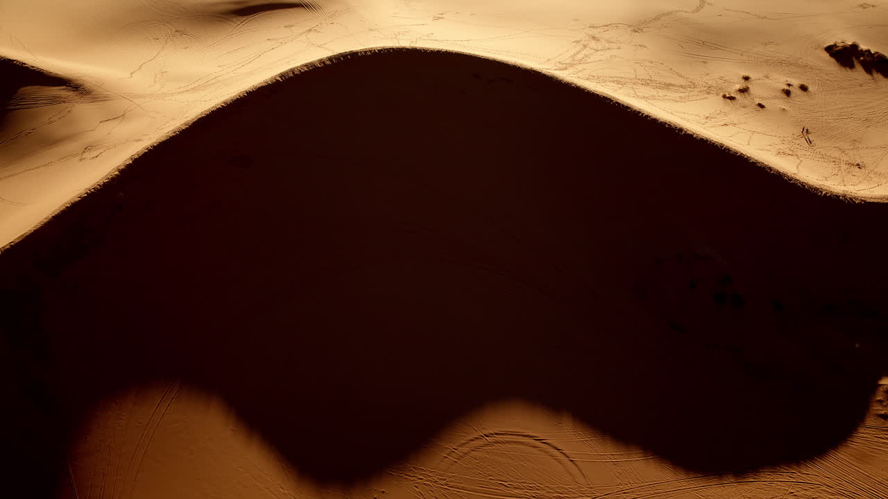 Southern Utah’s pink sand dunes appear like an abstract painting in this stunning drone capture.