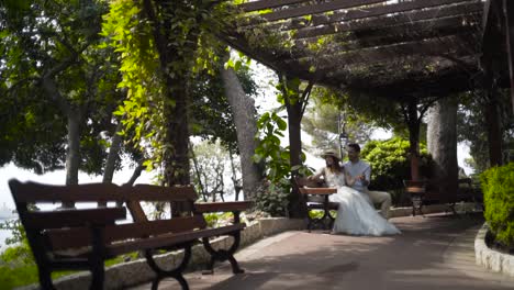 couple sitting on a bench in a park