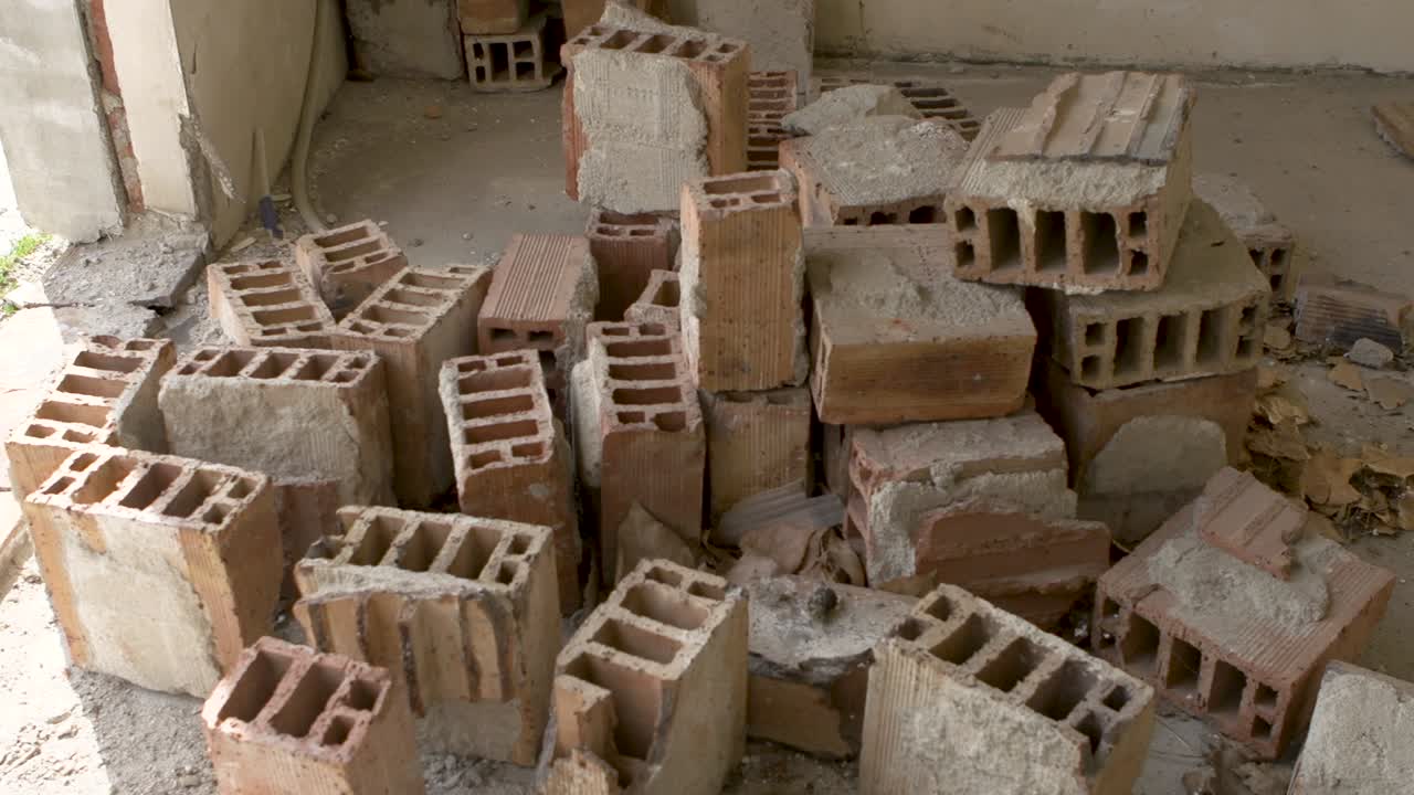 Bricks sit untouched in an incomplete building project in Sofia, Bulgaria. Many construction plans remain unfinished, leaving materials in disarray