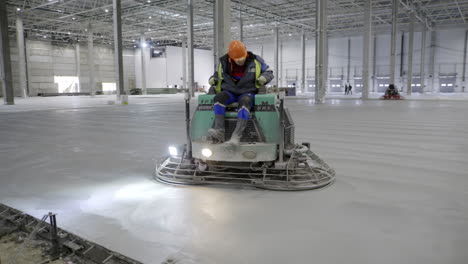 concrete floor finishing in a large warehouse