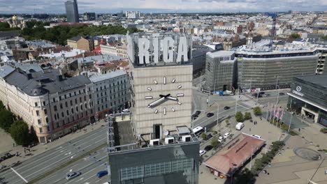 cinematic aerial orbiting of the riga train station clock tower in latvia, europe, drone part 1 of 3