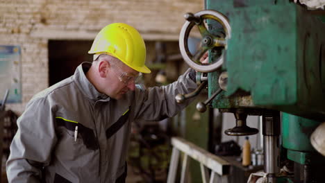 man checking machinery