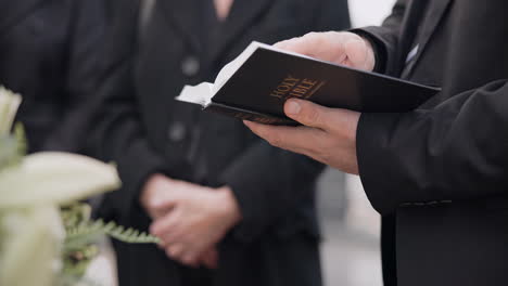 bible, funeral and hands reading of a priest