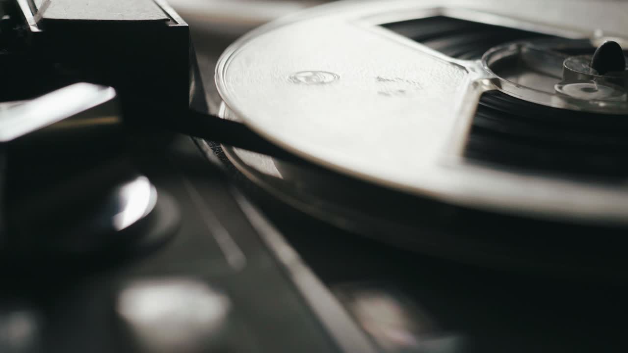 Reel film tape is rotating at a vintage professional player. Oldschool equipment