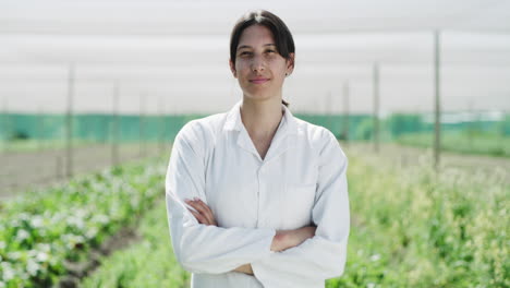 an attractive young female farmer posing