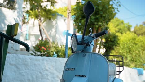 Close-Up-Of-Motorbike-Parked-In-Front-Of-House-During-Daytime-In-Kos,-Greece