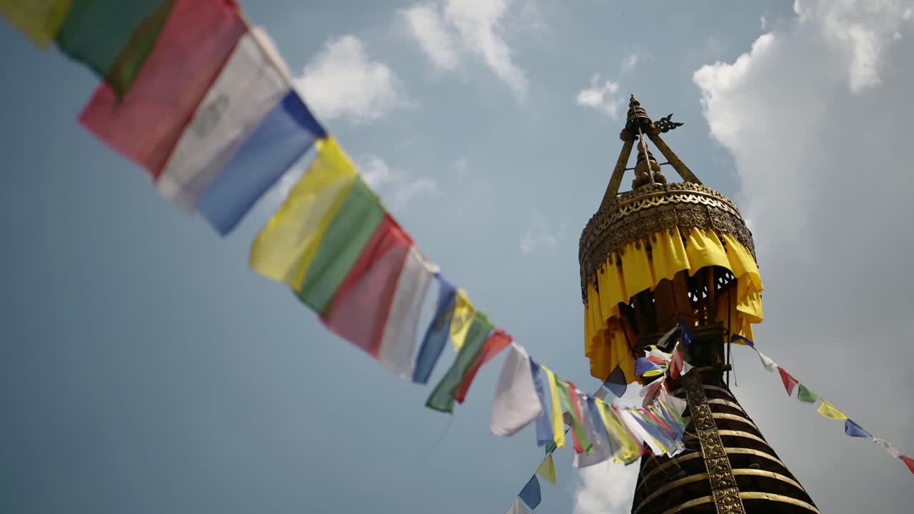 Kathmandu Buddhist Prayer Flags in Nepal at a Buddhist Temple, Close Up Detail of a Gold Stupa and Colorful Tibetan Prayer Flags with Beautiful Architecture and Architectural Details