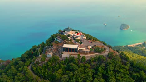 Aerial-4K-drone-video-of-a-Tunektepe-Teleferik
Cable-station-positioned-on-top-of-the-hill-with-the-mountains-in-the-background