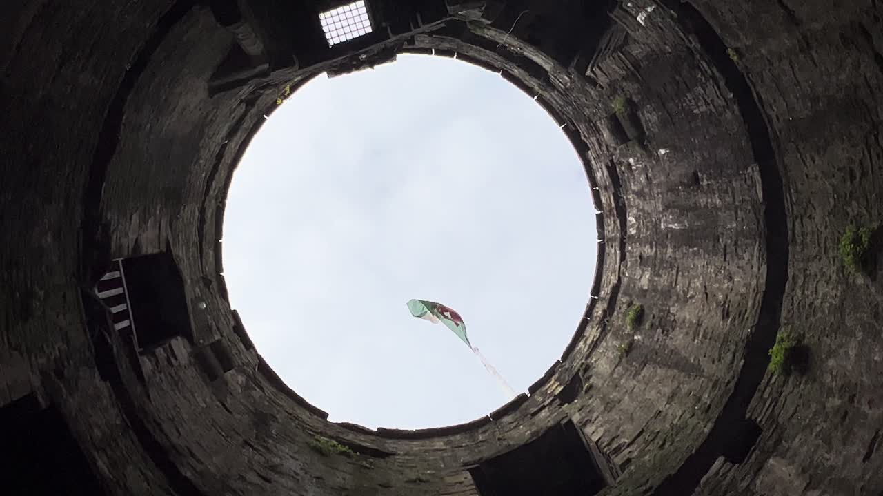 Looking Up Inside Castle Tower Welsh Flag Fluttering