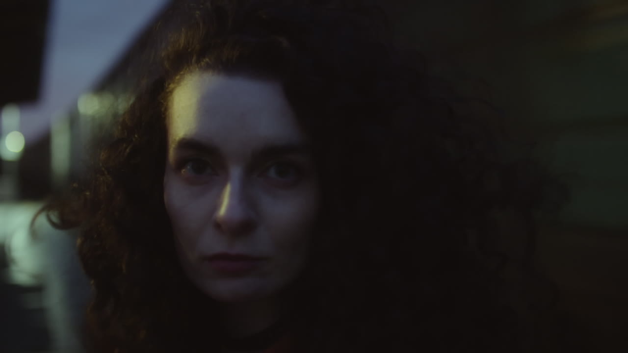 Portrait of Young Woman at Train Station