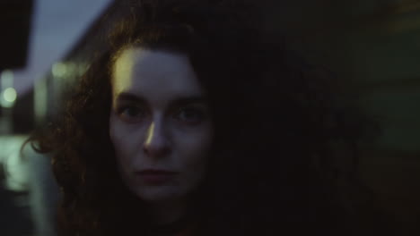 portrait of young woman at train station