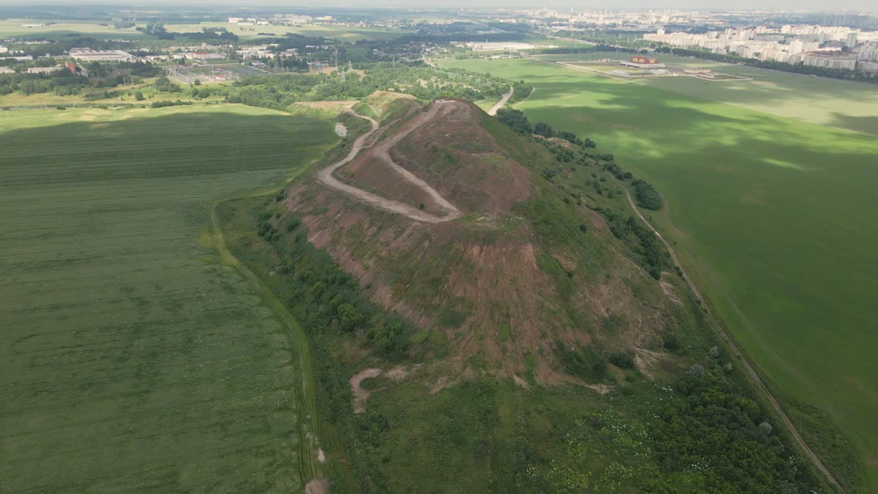 Household waste landfill. Closed for processing. Environment protection. Shooting with a flight from the object. Aerial photography.