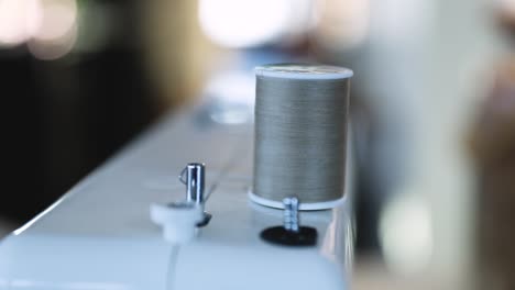 Close-Up-Of-Sewing-Machine-Using-Spool-Thread-In-Slow-Motion