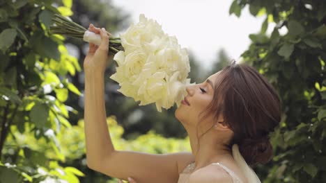 beautiful bride smiling with white roses bouquet